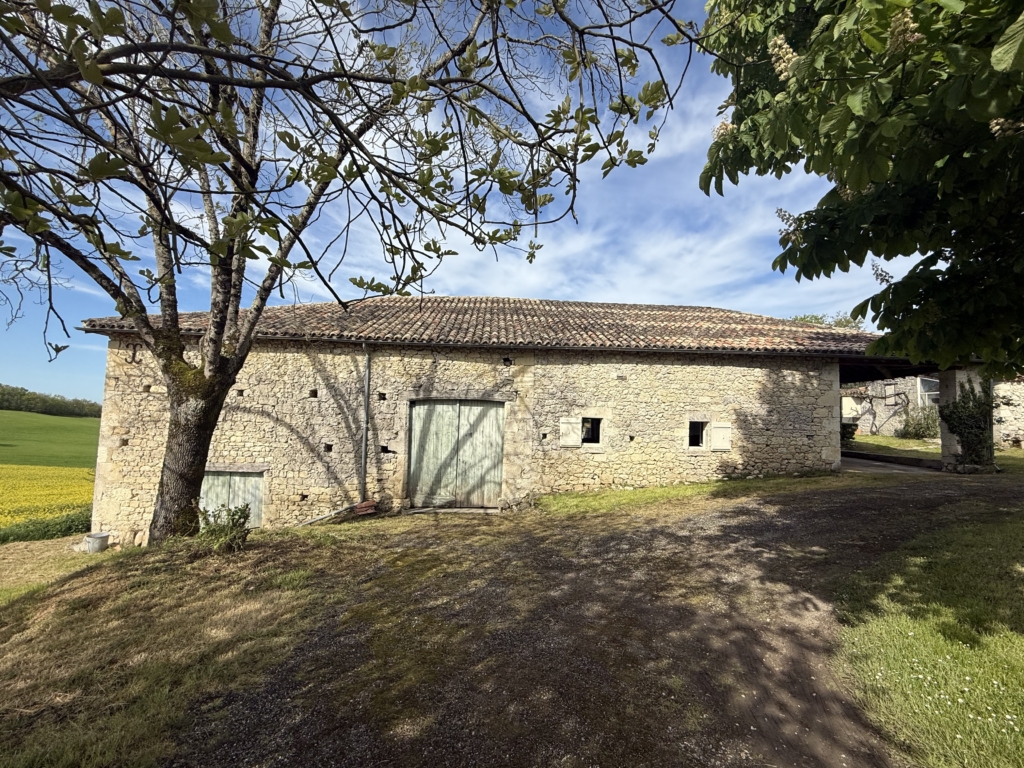 stone farmhouse with barn 